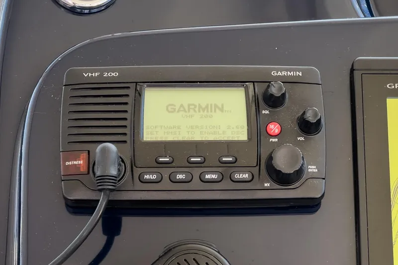 Slide: The Image of Garmin VHF 200 radio on 2018 Tiara Yachts 3100 Coronet dashboard. - 41