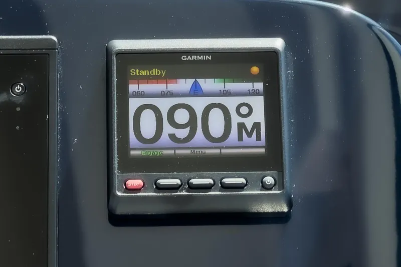 Slide: The Image of Garmin display on 2018 Tiara Yachts 3100 Coronet showing 090 degrees in standby mode. - 42