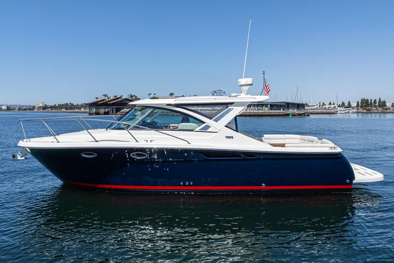 Slide: The Image of 2018 Tiara Yachts 3100 Coronet cruising on calm waters, showcasing sleek design and luxury features. - 5