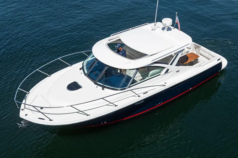 Slide: The Image of 2018 Tiara Yachts 3100 Coronet cruising on calm water, showcasing sleek design and luxury features. - 6