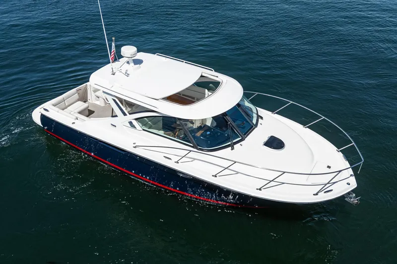 Slide: The Image of 2018 Tiara Yachts 3100 Coronet cruising on open water, showcasing sleek design and luxury features. - 7