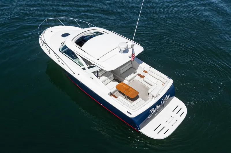 Slide: The Image of 2018 Tiara Yachts 3100 Coronet cruising on calm water, aerial view. - 8