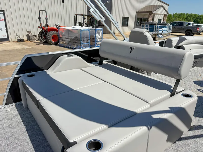 Slide: The Image of 2025 Trifecta 22 UL LE T 2.75 pontoon boat with gray seating and cup holders. - 7