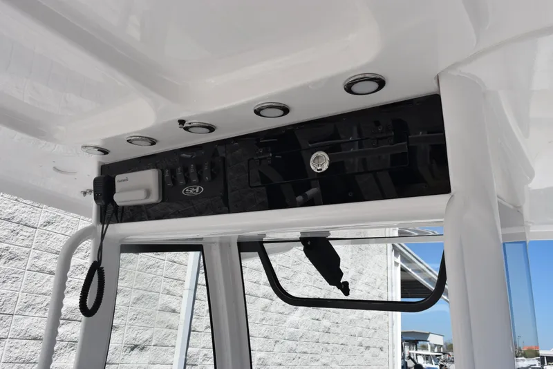 Slide: The Image of 2025 Sea Hunt Gamefish 28 boat console with modern controls and sleek design. - 11