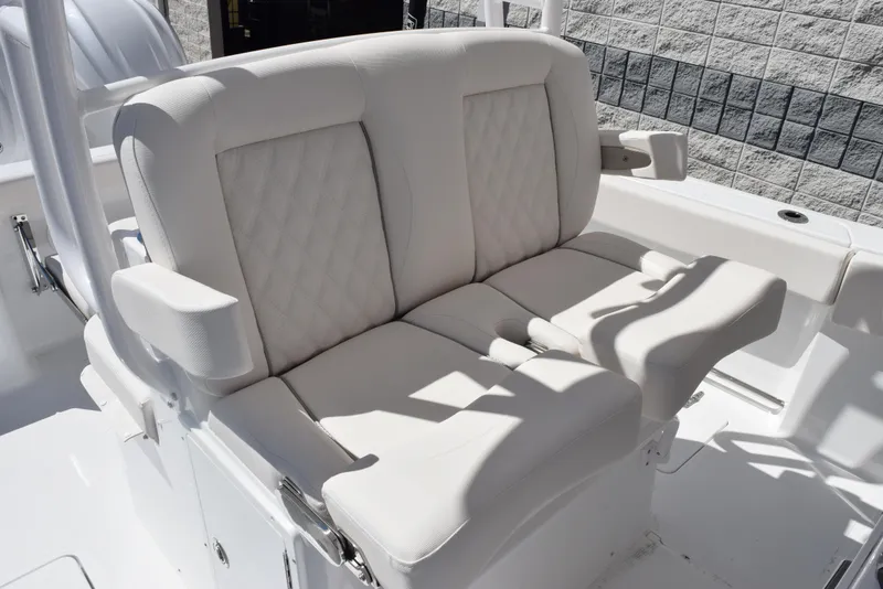 Slide: The Image of 2025 Sea Hunt Gamefish 28 boat with luxurious white seating and armrests. - 12