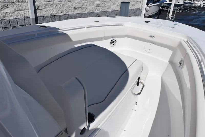 Slide: The Image of 2025 Sea Hunt Gamefish 28 boat interior with cushioned seating and cup holders. - 13