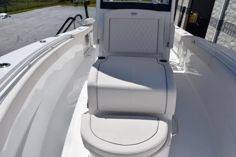 Slide: The Image of 2025 Sea Hunt Gamefish 28 boat interior with cushioned seating and sleek design. - 14