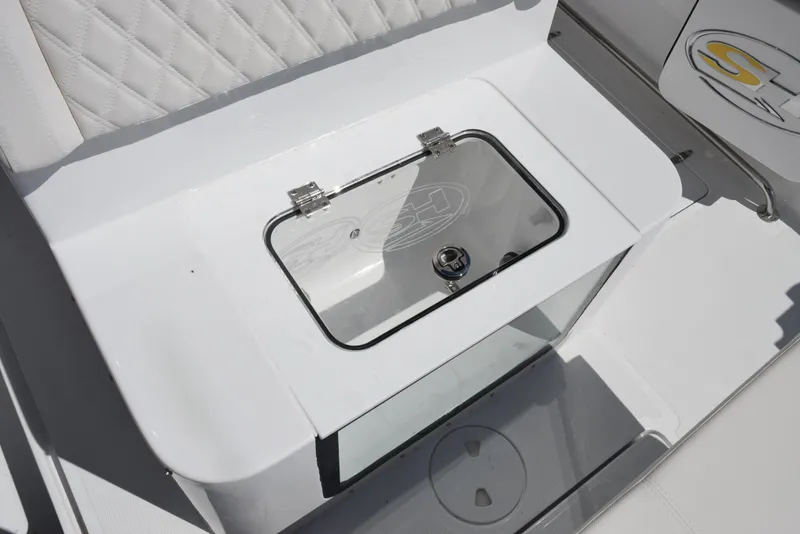 Slide: The Image of 2025 Sea Hunt Gamefish 28 livewell with transparent lid and sleek white design. - 20