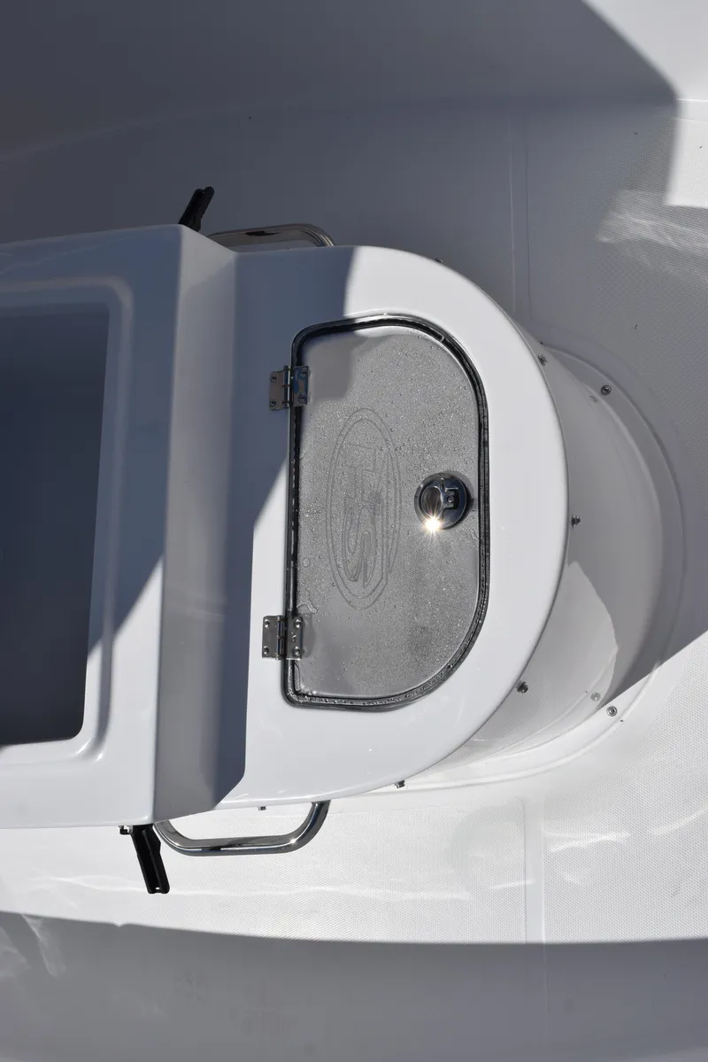 Slide: The Image of 2025 Sea Hunt Gamefish 28 livewell with transparent lid and stainless steel hardware. - 25