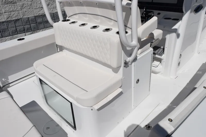 Slide: The Image of 2025 Sea Hunt Gamefish 28 boat interior with cushioned seating and rod holders. - 8