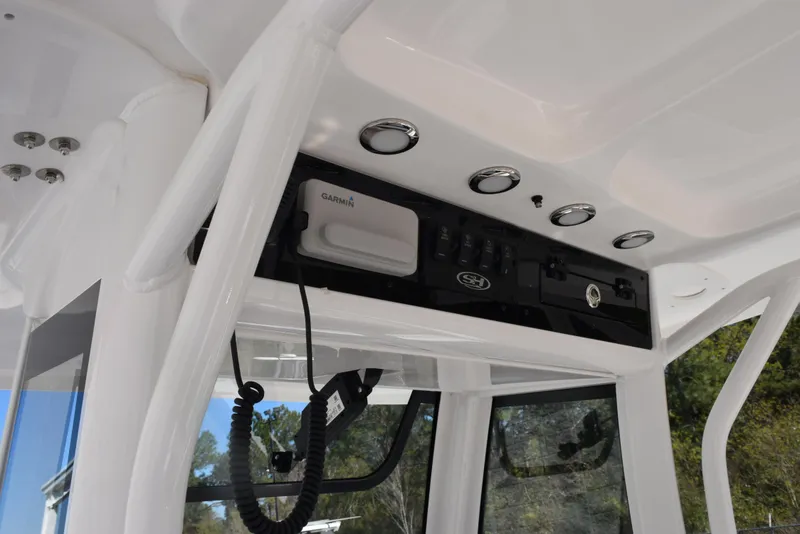 Slide: The Image of 2025 Sea Hunt Ultra 265 SE boat console with Garmin electronics and sleek design. - 10