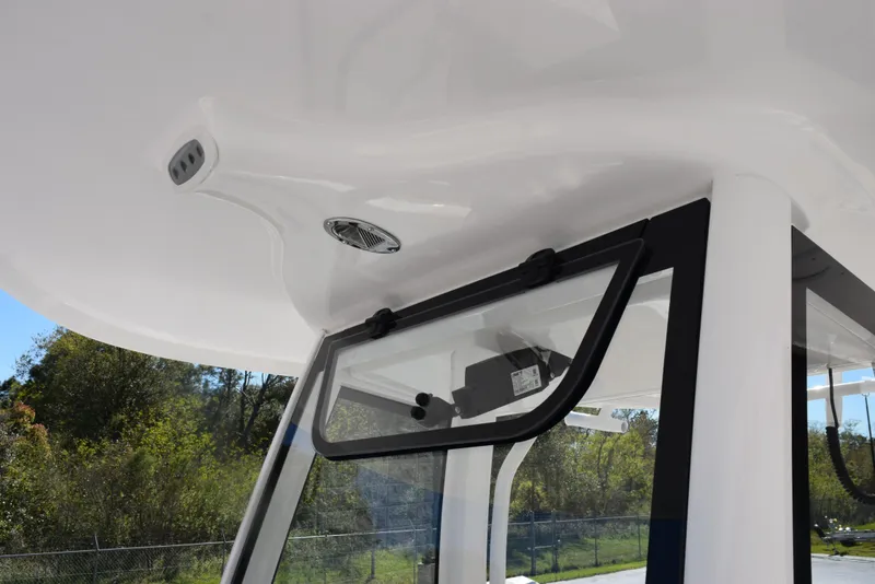 Slide: The Image of 2025 Sea Hunt Ultra 265 SE boat interior with open window and ceiling details. - 14