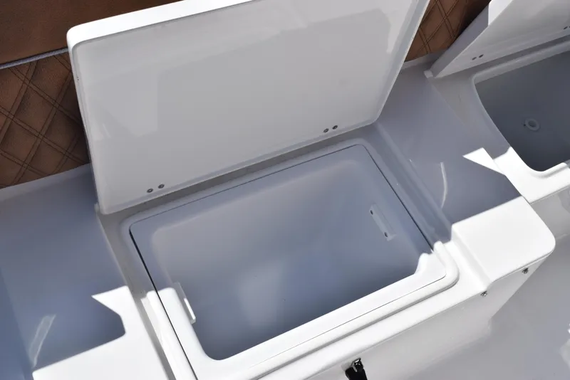 Slide: The Image of Open storage compartment on 2025 Sea Hunt Ultra 265 SE boat. - 24