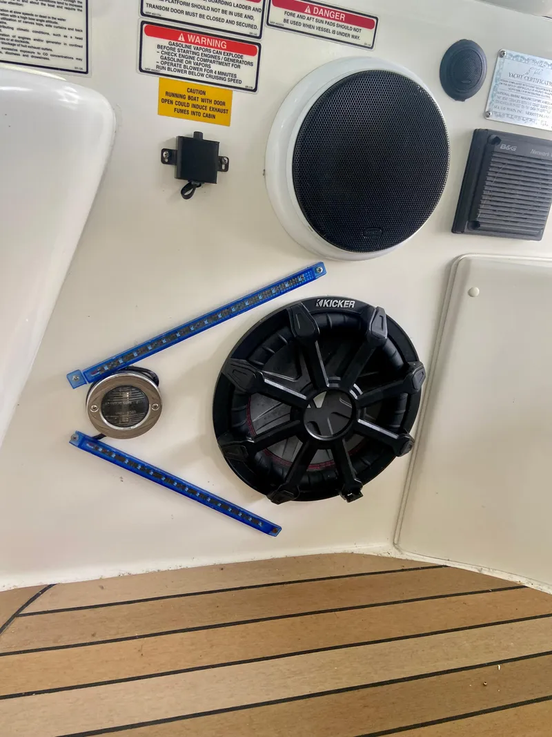 Slide: The Image of 1997 Sea Ray 400 Sundancer boat audio system with speakers and control panel. - 30