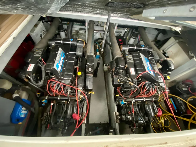 Slide: The Image of Engine compartment of a 1997 Sea Ray 400 Sundancer with twin MerCruiser engines. - 31