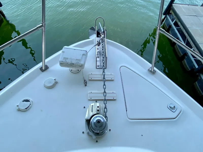 Slide: The Image of Bow of 1997 Sea Ray 400 Sundancer with anchor chain and railing. - 5