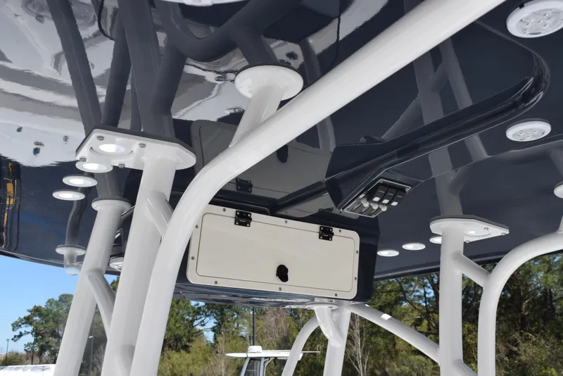 Slide: The Image of 2025 BlackJack 256 Coastal boat T-top with electronics and storage compartment. - 12