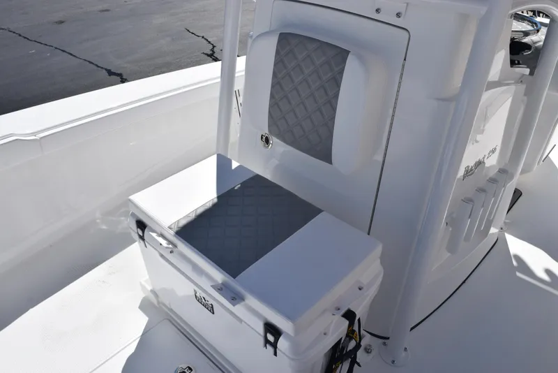 Slide: The Image of 2025 BlackJack 256 Coastal boat interior with cushioned seating and storage. - 15