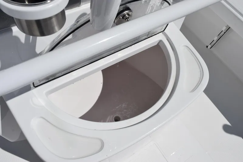 Slide: The Image of 2025 BlackJack 256 Coastal boat interior detail, featuring a white storage compartment. - 22