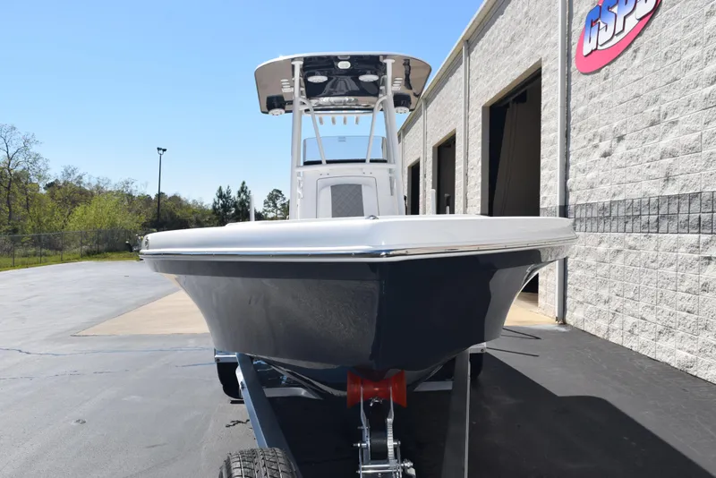 Slide: The Image of 2025 BlackJack 256 Coastal boat on trailer outside a building. - 3