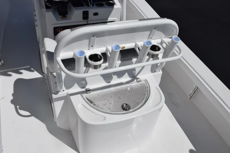 Slide: The Image of 2025 BlackJack 256 Coastal boat with rod holders and livewell on deck. - 9