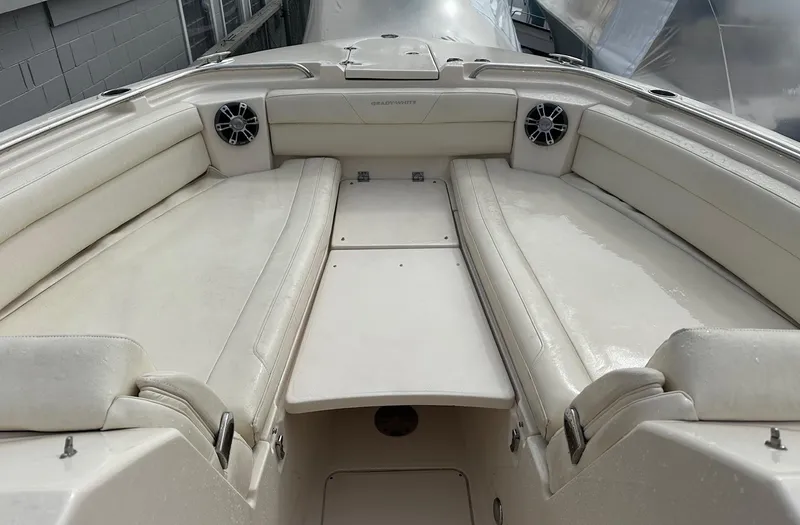 Slide: The Image of 2022 Grady-White 325 Freedom boat interior with spacious seating and speakers. - 12