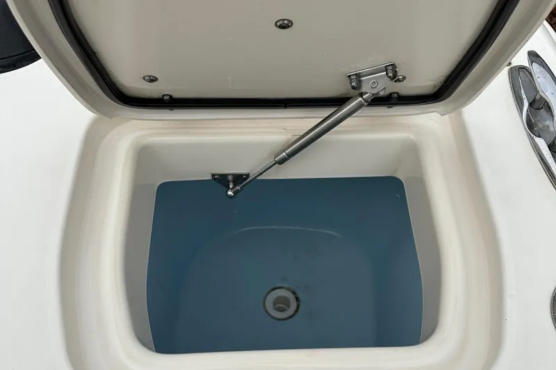 Slide: The Image of Open storage compartment on 2022 Grady-White 325 Freedom boat. - 17