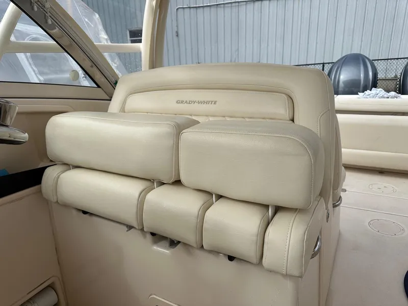 Slide: The Image of 2022 Grady-White 325 Freedom boat interior with beige leather seating. - 5