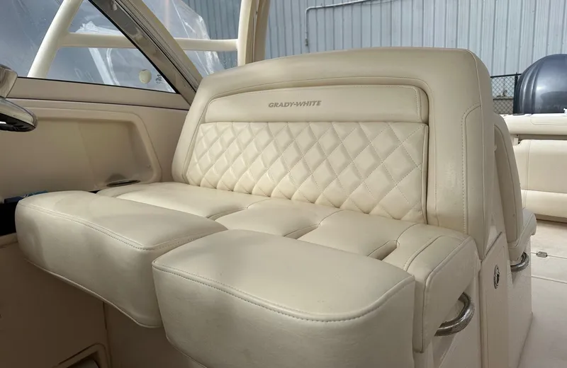 Slide: The Image of Luxurious seating on 2022 Grady-White 325 Freedom boat with quilted upholstery. - 6