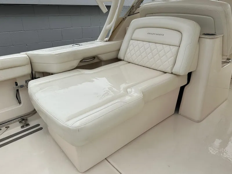 Slide: The Image of Luxurious seating on 2022 Grady-White 325 Freedom boat, featuring elegant white upholstery. - 8
