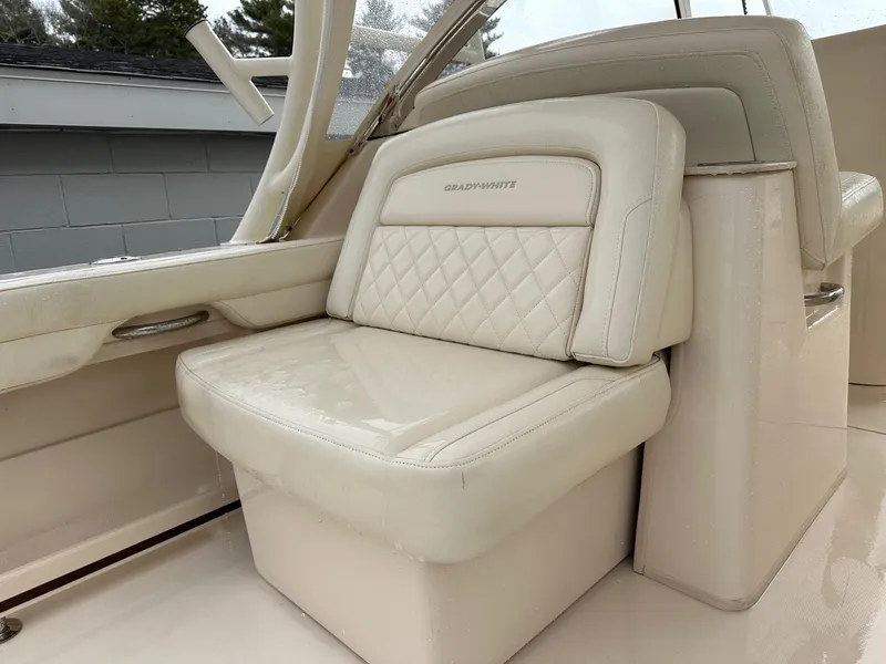 Slide: The Image of 2022 Grady-White 325 Freedom boat seat with quilted design and beige upholstery. - 9