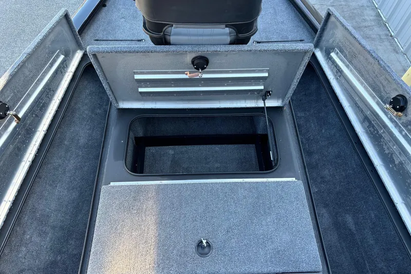 Slide: The Image of 2024 Tracker Pro Team 195 TXW Tournament Edition boat storage compartments. - 3