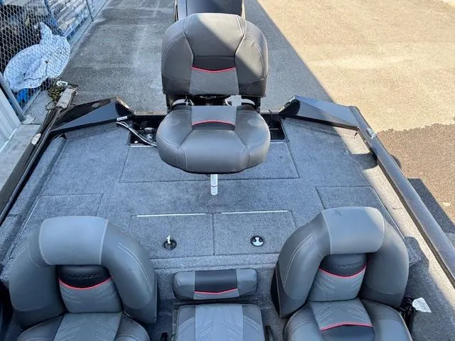 Slide: The Image of 2024 Tracker Pro Team 195 TXW Tournament Edition boat interior with gray seating and carpet. - 7