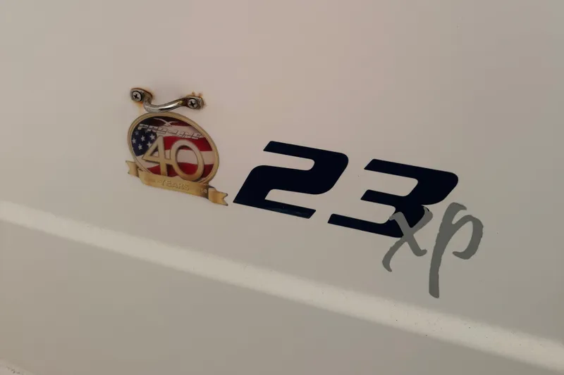 Slide: The Image of 2008 Pro-Line 23 XP boat emblem with 40th anniversary badge. - 11