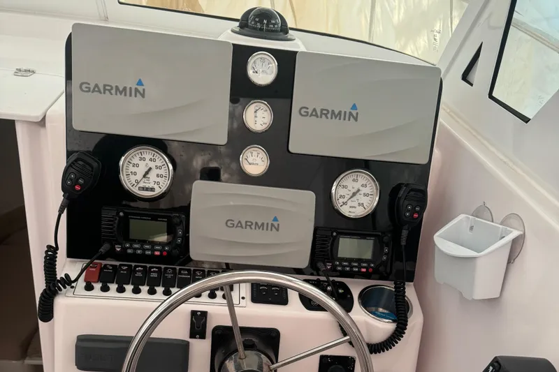 Slide: The Image of Control panel of 2008 Pro-Line 23 XP boat with Garmin navigation systems. - 4