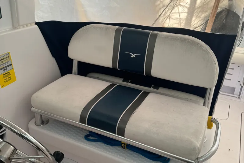 Slide: The Image of 2008 Pro-Line 23 XP boat seat with blue and gray upholstery. - 5