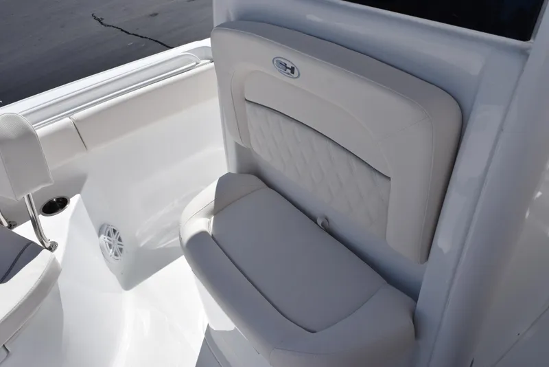 Slide: The Image of 2025 Sea Hunt Ultra 235 SE boat seat with white cushioned design. - 13