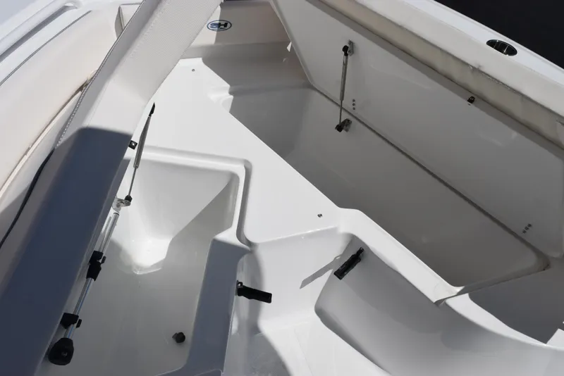 Slide: The Image of 2025 Sea Hunt Ultra 235 SE boat storage compartments, showcasing spacious and organized design. - 14