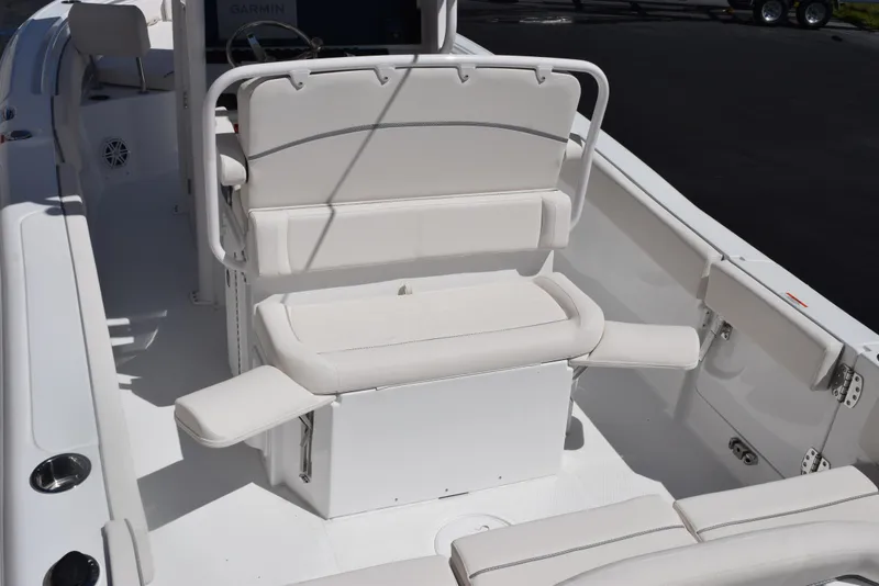 Slide: The Image of 2025 Sea Hunt Ultra 235 SE boat interior with white cushioned seating. - 7