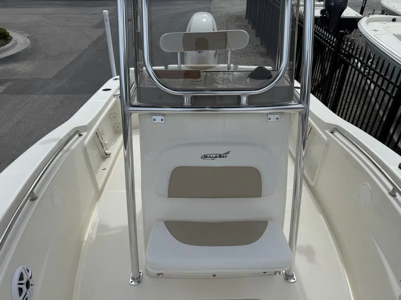 Slide: The Image of 2025 Bulls Bay 200 CC boat console with seating and stainless steel frame. - 16
