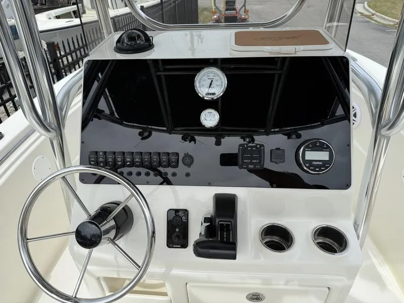 Slide: The Image of 2025 Bulls Bay 200 CC boat dashboard with Garmin display and gauges. - 5
