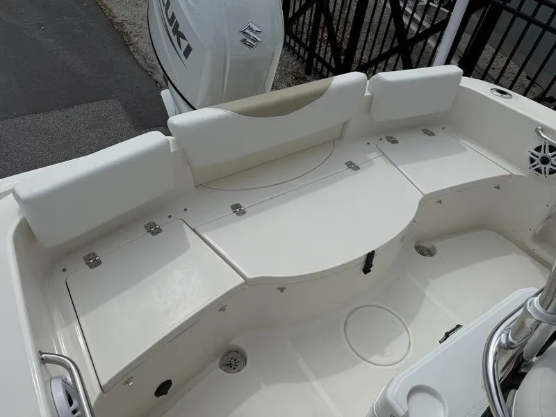 Slide: The Image of 2025 Bulls Bay 200 CC boat interior with cushioned seating and storage compartments. - 9