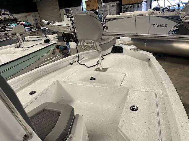 Slide: The Image of 2025 Xpress Hyper Lift H20 Bay boat interior with seating and storage compartments. - 12