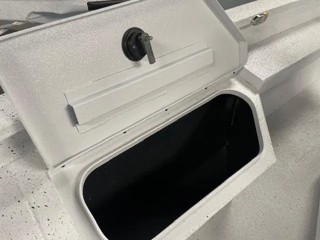 Slide: The Image of Open storage compartment on 2025 Xpress Hyper Lift H20 Bay boat. - 15