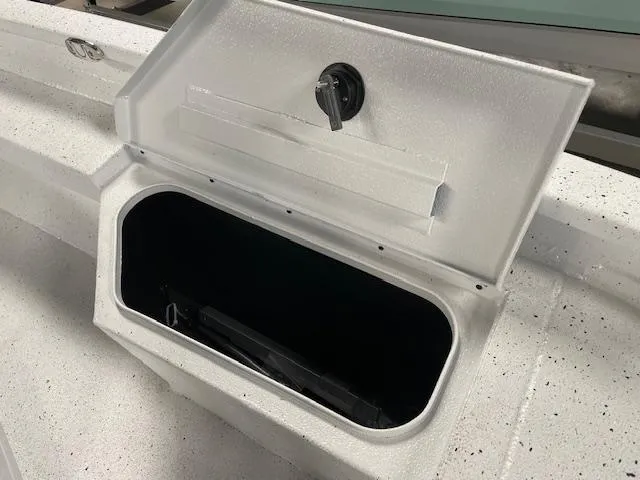 Slide: The Image of Open storage compartment on 2025 Xpress Hyper Lift H20 Bay boat. - 16