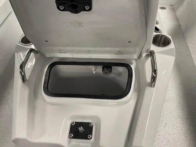 Slide: The Image of Open storage compartment on 2025 Xpress Hyper Lift H20 Bay boat. - 17