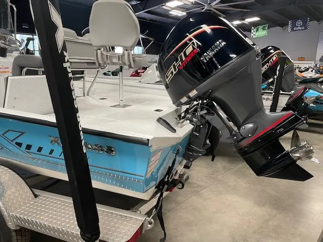 Slide: The Image of 2025 Xpress Hyper Lift H20 Bay boat with Yamaha engine in showroom. - 3