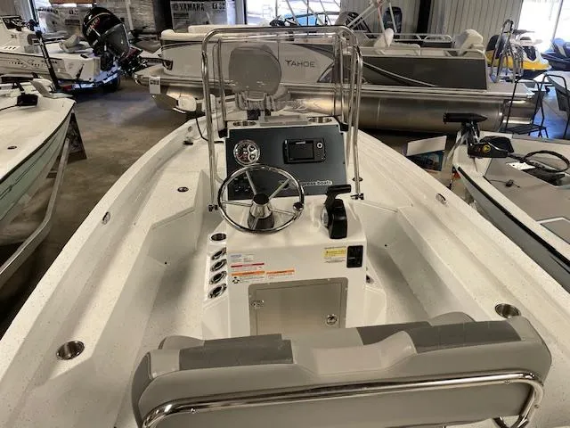 Slide: The Image of 2025 Xpress Hyper Lift H20 Bay boat interior with steering console in showroom. - 8