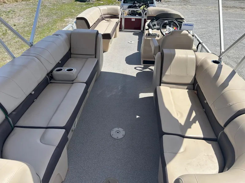 Slide: The Image of 2018 Sun Tracker Party Barge 22 DLX XP3 interior with spacious seating and steering console. - 10