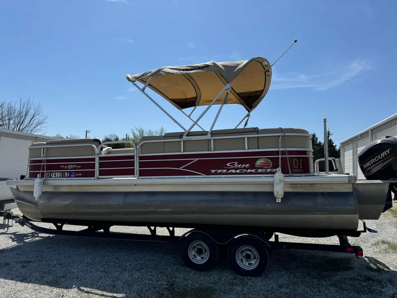 Slide: The Image of 2018 Sun Tracker Party Barge 22 DLX XP3 pontoon boat on trailer, with canopy. - 11